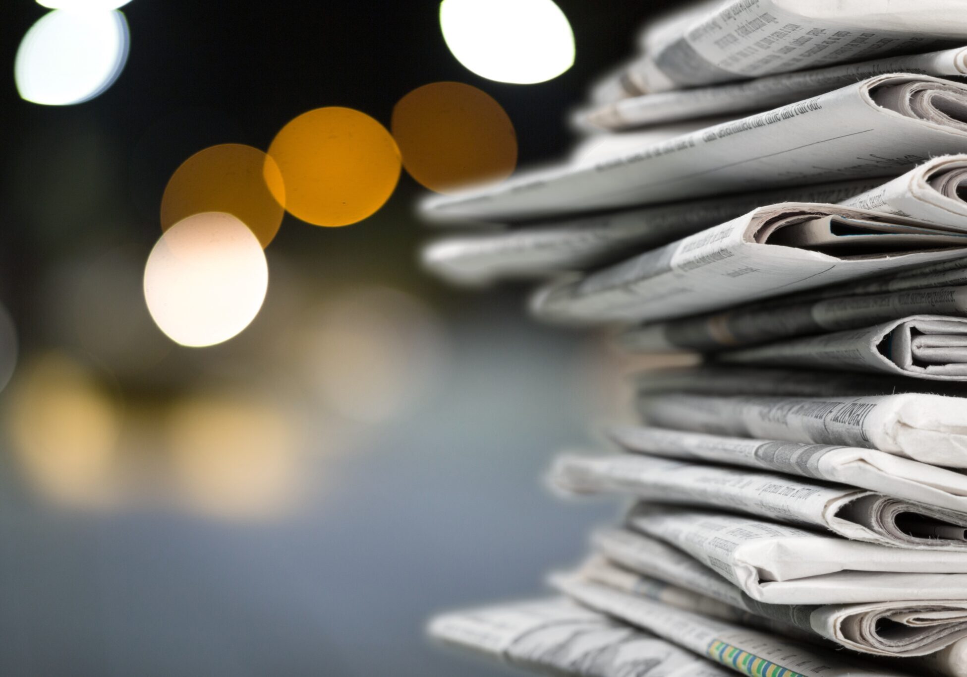 Pile of newspapers on blur background